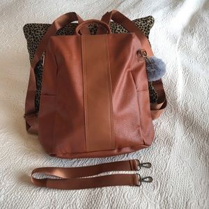 A convertible 3 way brown backpack/purse